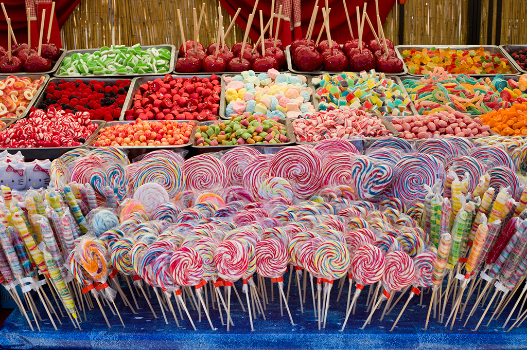 Bunch of different candies on stand for sale
